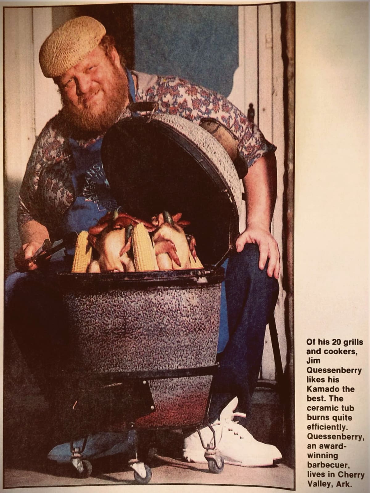 Jim Quessenberry preparing chicken legs on a charcoal grill.